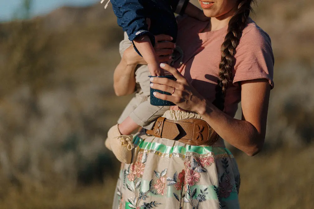 Young American Indian mother holding a child.